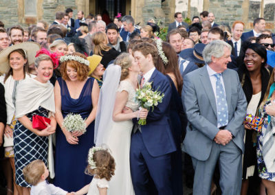 bridal party kissing at St. Friars, Trearddur Bay, Anglesey