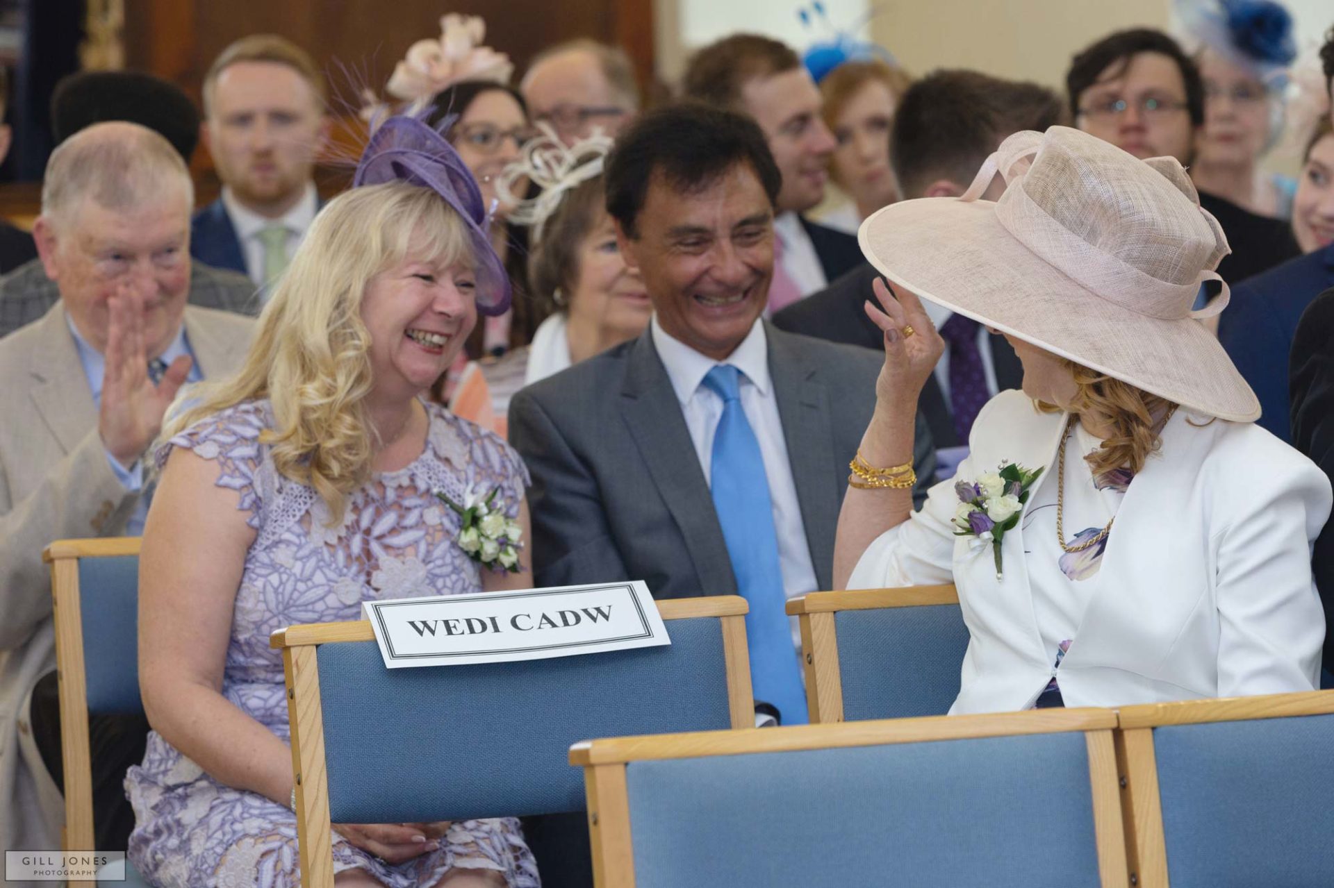 a guest is waving at the bride's mother at a north wales wedding