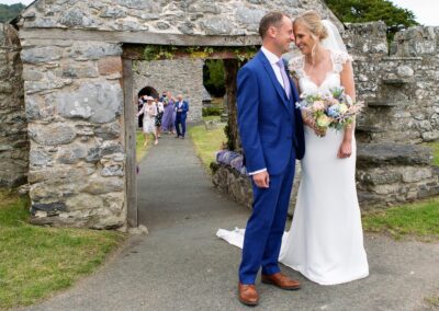 the bride and groom touch foreheads after their ceremonyat St. Mary's Church , Caerhun by Anglesey wedding photographer Gill Jones Photography