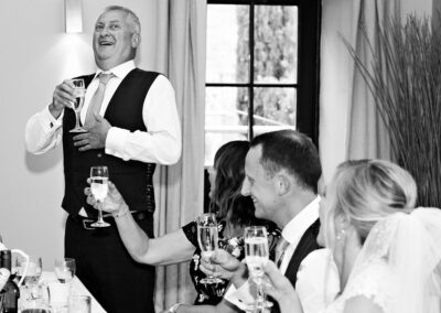 the groom's father takes a sharp intake of breath before his speech at Bodnant Food centreby Anglesey wedding photographer Gill Jones