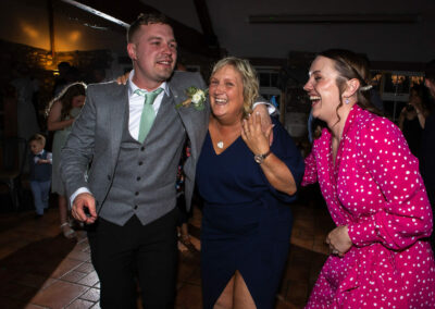 groom dances with his mother on the dance floor by Anglesey wedding photographer, North Wales, Gill Jones Photography