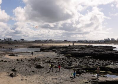 trearddur bay in May with people flying kites