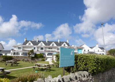 the front view of the trearddur Bay hotel on a sunny day