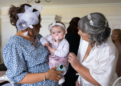 bride saying hello to her baby granddaughter