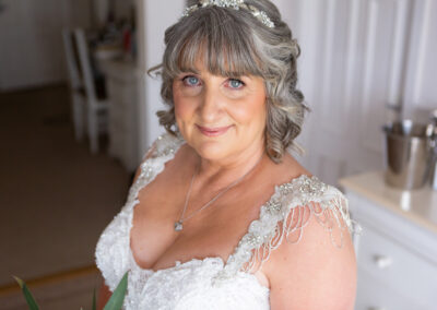 bride looking straight at the camera, a before ceremony portrait