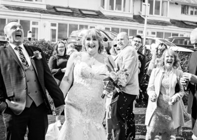the groom laughs as his friend's confetti bomb doesn't go off