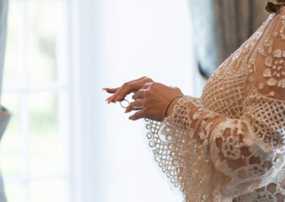 bride's hands, moving her engagement ring to het other hand by Anglesey wedding photographer Gill Jones Photography