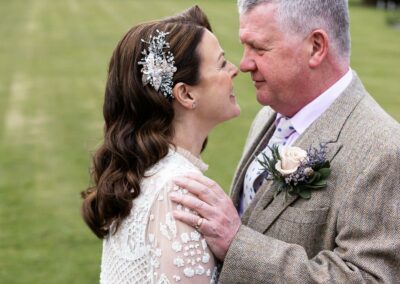 bride and groom nose to nose by Anglesey wedding photographer Gill Jones Photography