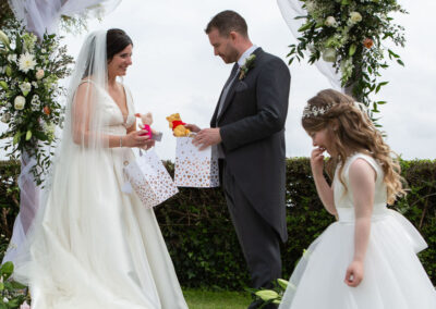 a bridesmaid has given her parents a gift of Piglet and Winnie the Pooh by Anglesey photographer Gill Jones Photography