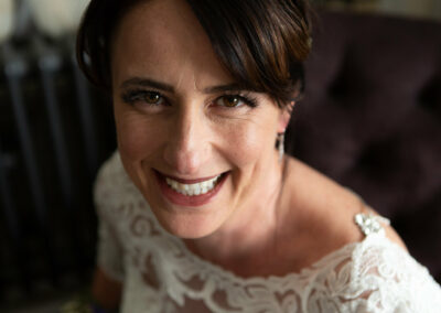 bride offering the camera a huge smile by Anglesey wedding photographer Gill Jones Photography
