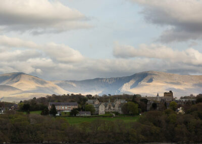 old Bangor university building with Snowdonia mountains in the background by Anglesey wedding photographer Gill Jones Photography