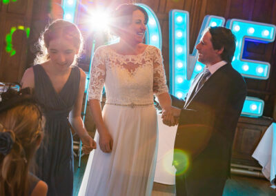 guests dancing to music on a dance floor by Anglesey wedding photographer Gill Jones Photography